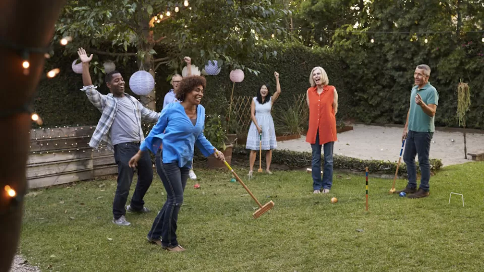 A group playing garden party games.