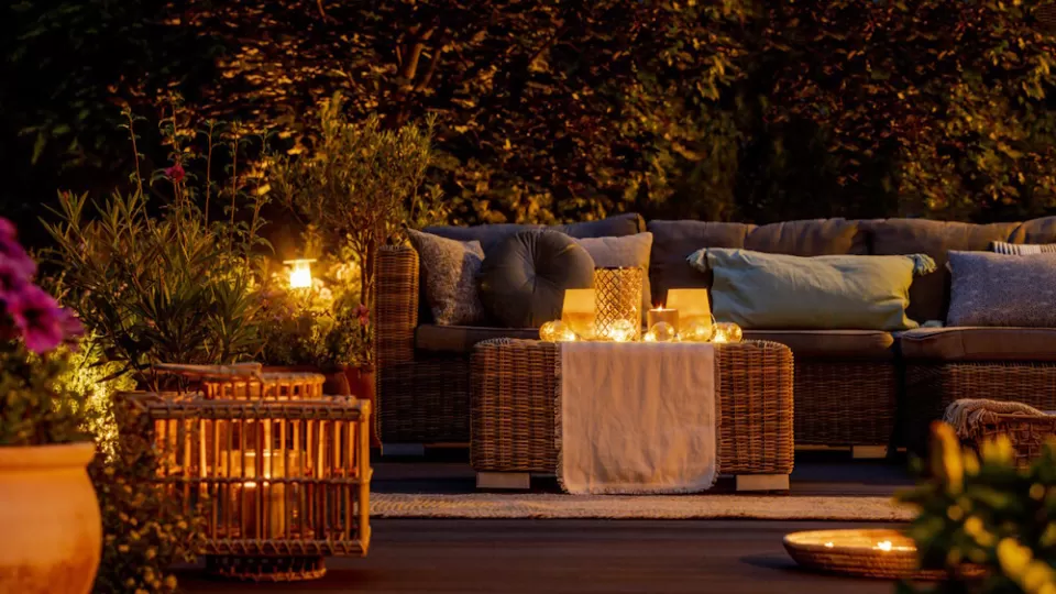 Lit candles creating a warm environment in the garden.